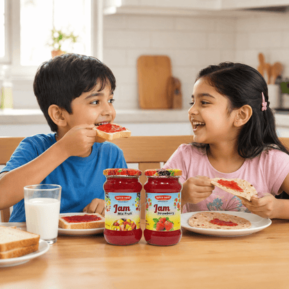 Two jars of Spice Nest real fruit jam in mixed fruit and strawberry flavors
